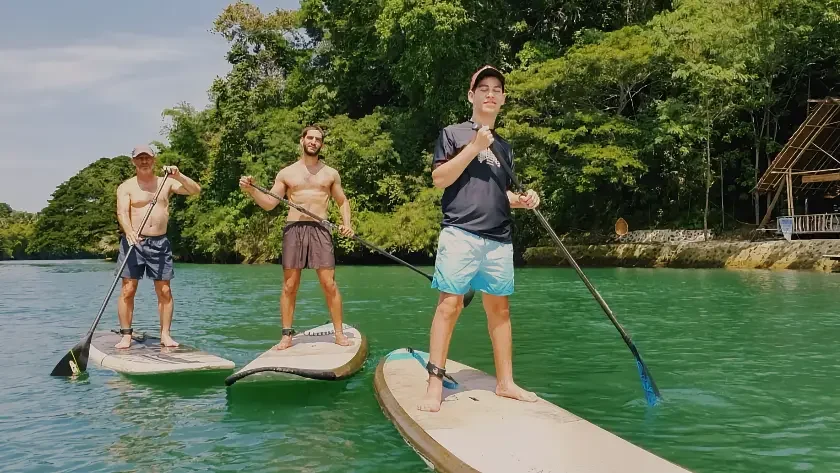 125638 bohol countryside adventure tour Friends moving across the water on stand up paddle boards