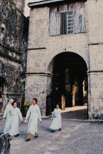 Baclayon Bohol Travel Guide: Heritage Churches, Local Flavors, and Port to Pamilacan 6 baclayon church sisters below limestone walls dsc1847 w400