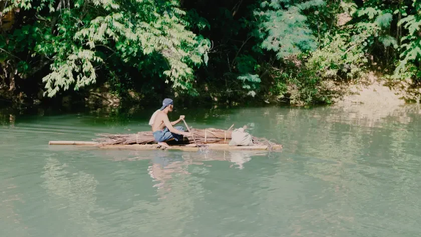 Top 10 Bohol Photography Tours: Capture Paradise's Most Iconic Instagram Views 1 loboc-river-local-riding-bamboo-raft